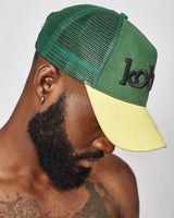 KOBO Suede Trucker Hat: Naija Forest & Palm Gold